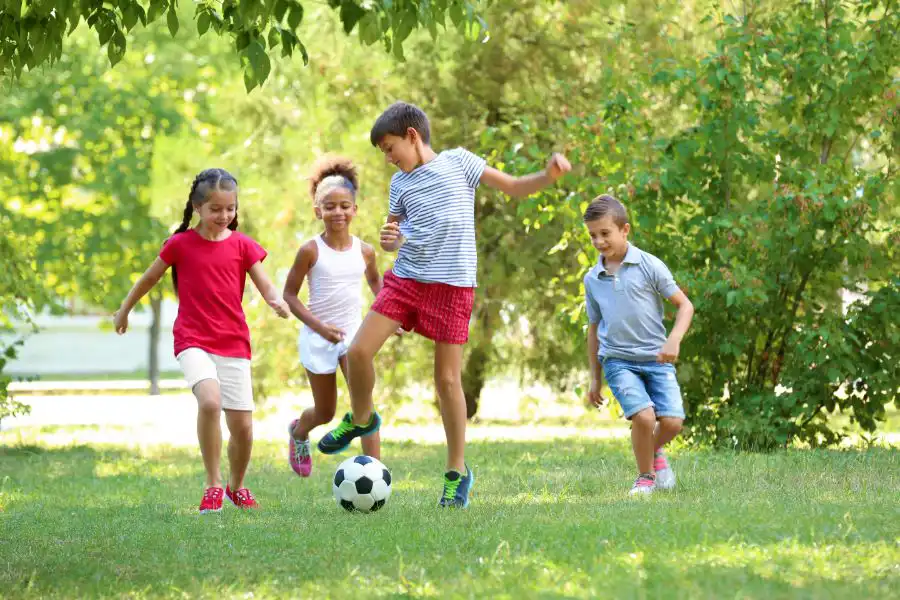 A group of kids playing soccer in a field - Keep mosquitoes away from your home with Florida Pest Control in Gainesville FL