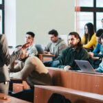 Students sitting in classroom listening to a lecture