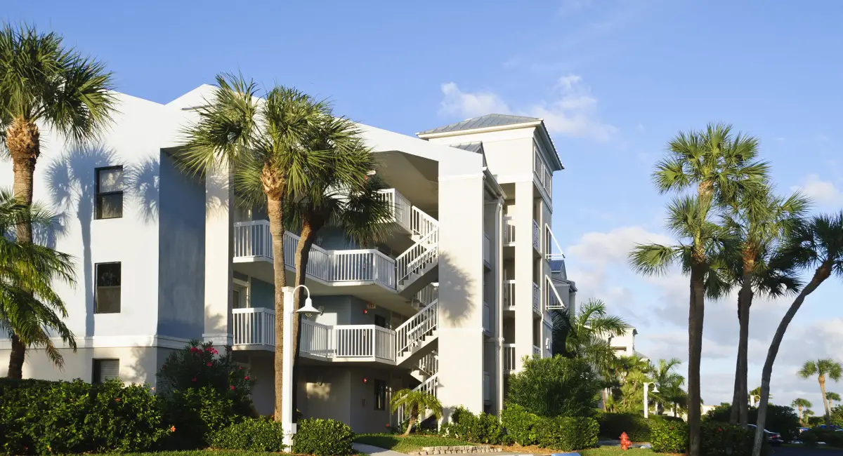 Florida multifamily community with water features and palm trees, at risk for pest activity during hurricane season.