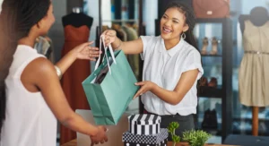 retail worker handing over purchase
