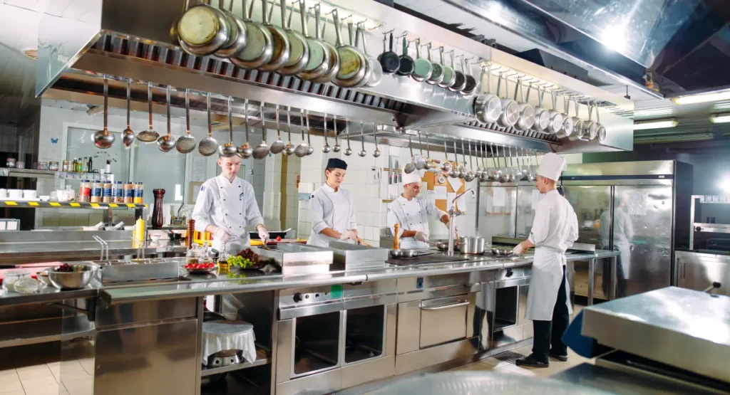 Chef’s preparing a meal in a restaurant kitchen