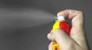 aerosol insecticide can being sprayed