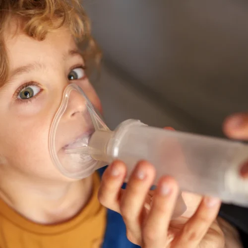 young boy receiving asthma treatment