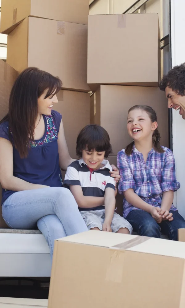 image-stock-2500-family-sitting-on-back-of-moving-van-135385174